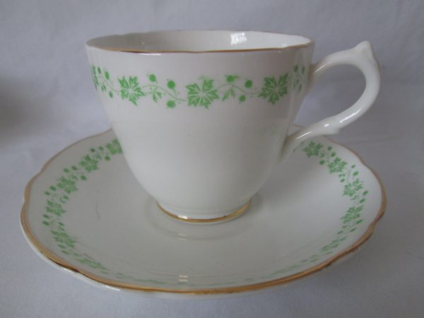 Beautiful Vintage Tea Cup and Saucer Fine Bone China English Castle Saffordshire England White with green leaves & berries