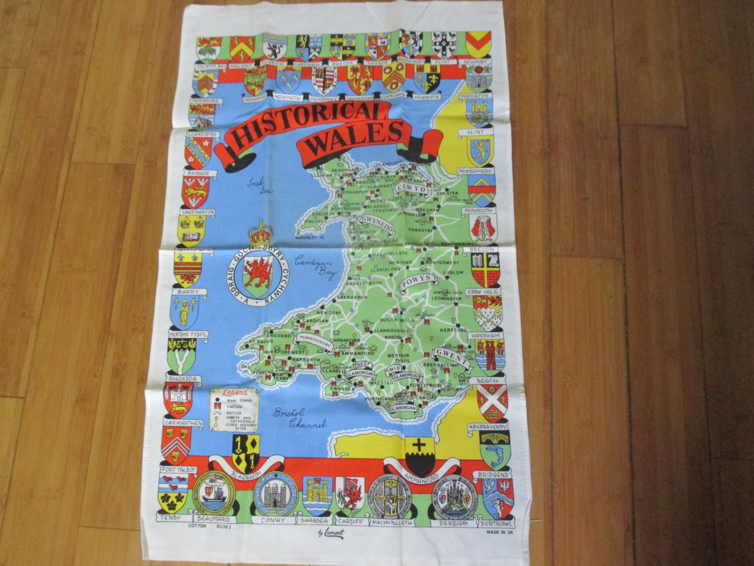 https://www.truevintageantiques.com/wp-content/uploads/2017/07/mid-century-colorful-kitchen-towel-new-old-stock-unused-100-cotton-vivid-colors-historical-wales-flags-country-bristol-channel-595be9461.jpg