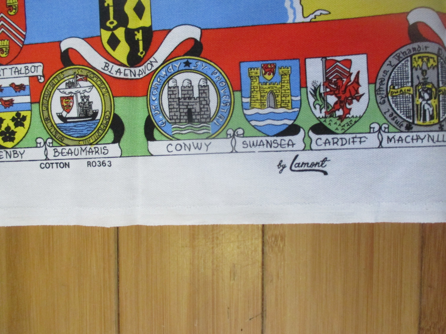 https://www.truevintageantiques.com/wp-content/uploads/2017/07/mid-century-colorful-kitchen-towel-new-old-stock-unused-100-cotton-vivid-colors-historical-wales-flags-country-bristol-channel-595be95c4.jpg