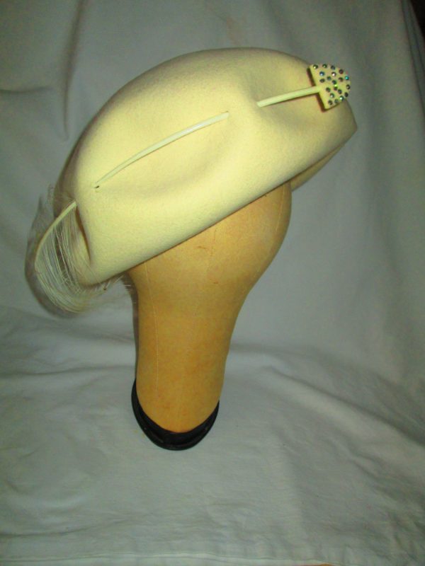 Stunning Ivory Tam Style Hat Pierced with an Arrow and feather Rhinestones Tom Hann Studios