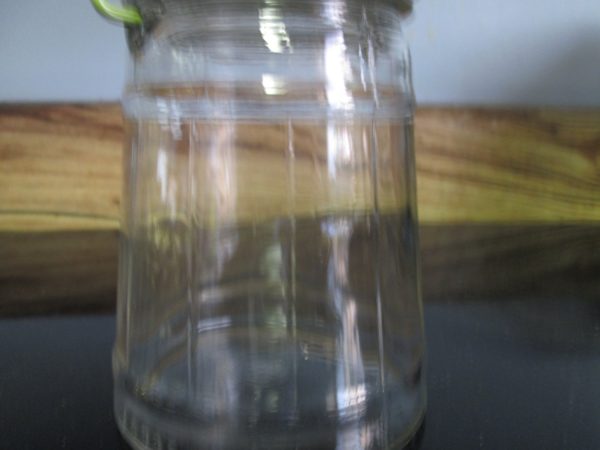 Vintage glass pickle jar with green metal lid and bail wire handle ribbed glass collectibles marbles dog cat treats buttons display storage
