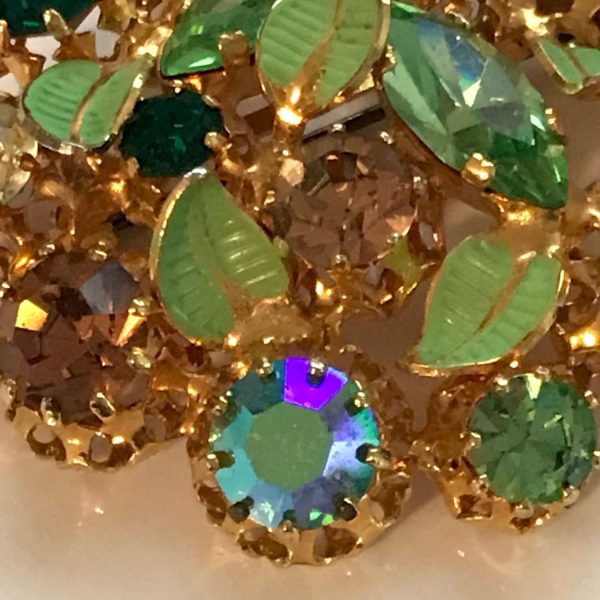 Antique Austrian Crystal brooch with matching clip earrings green gold  blue enameled green leaves Marked made in Austria 1920's