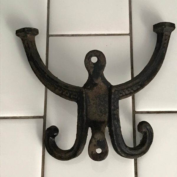 Antique hook cast iron wall hook collectible display farmhouse cabin lodge rustic decor coats hats backpacks towels