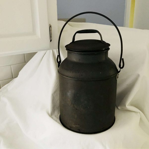 Antique lightly rusted metal milk or cream can 8 quart can set in lid with handle and carry handle on can Farmhouse Collectible display