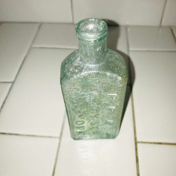 Antique Pharmacy Apothecary Medical Bottle Iridescent Green Pharmaceutical Doctor Medicine bottle collectible display R.R.R. Radway New York