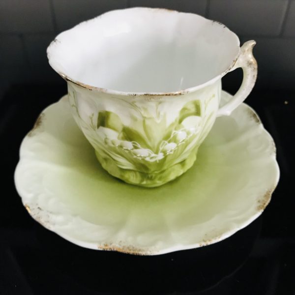 Antique Tea cup and saucer Hand painted enameled Lily of the Valley Green background Fine bone china gold trim farmhouse collectible display