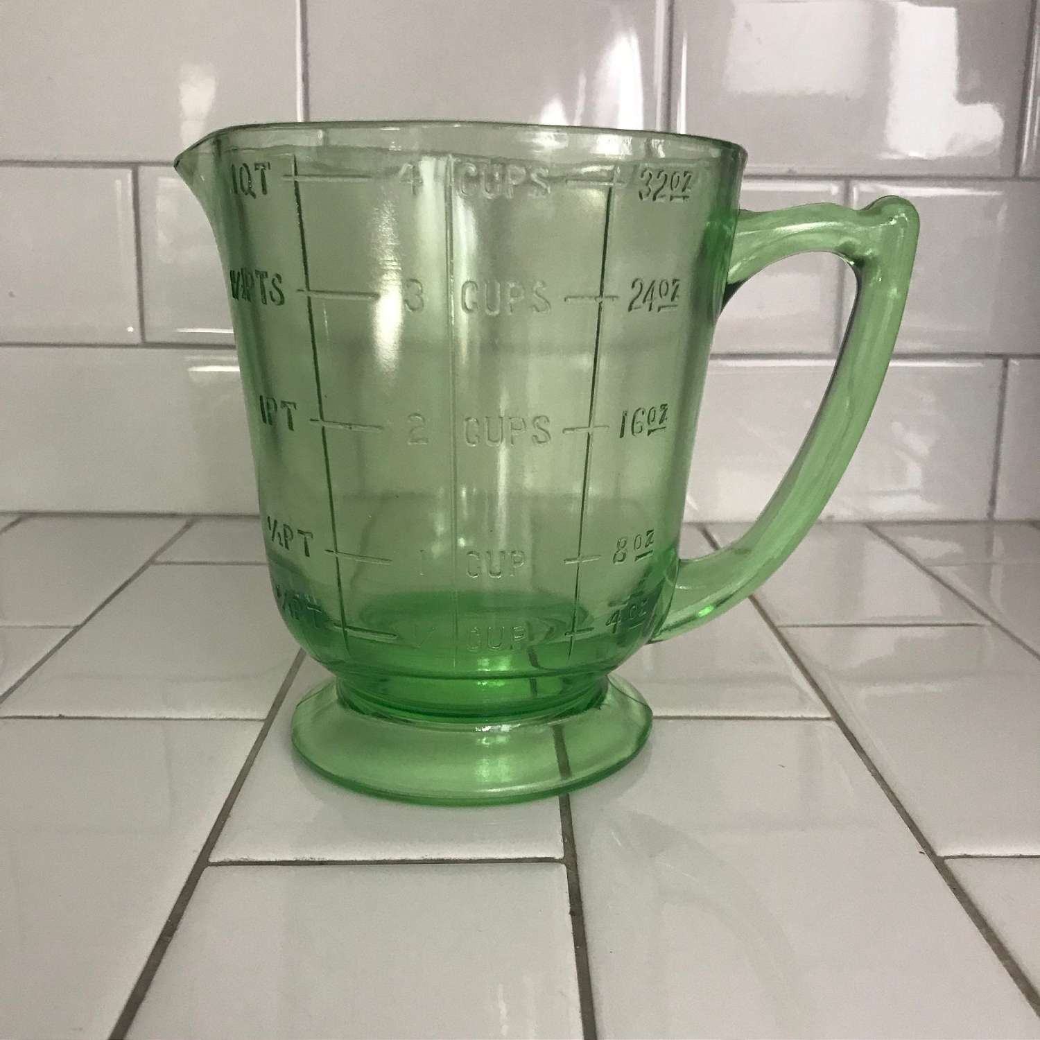 https://www.truevintageantiques.com/wp-content/uploads/2019/12/antique-uranium-glass-measuring-cup-4-cups-green-kitchen-collectible-display-farmhouse-glows-green-5df1793b6-scaled.jpg