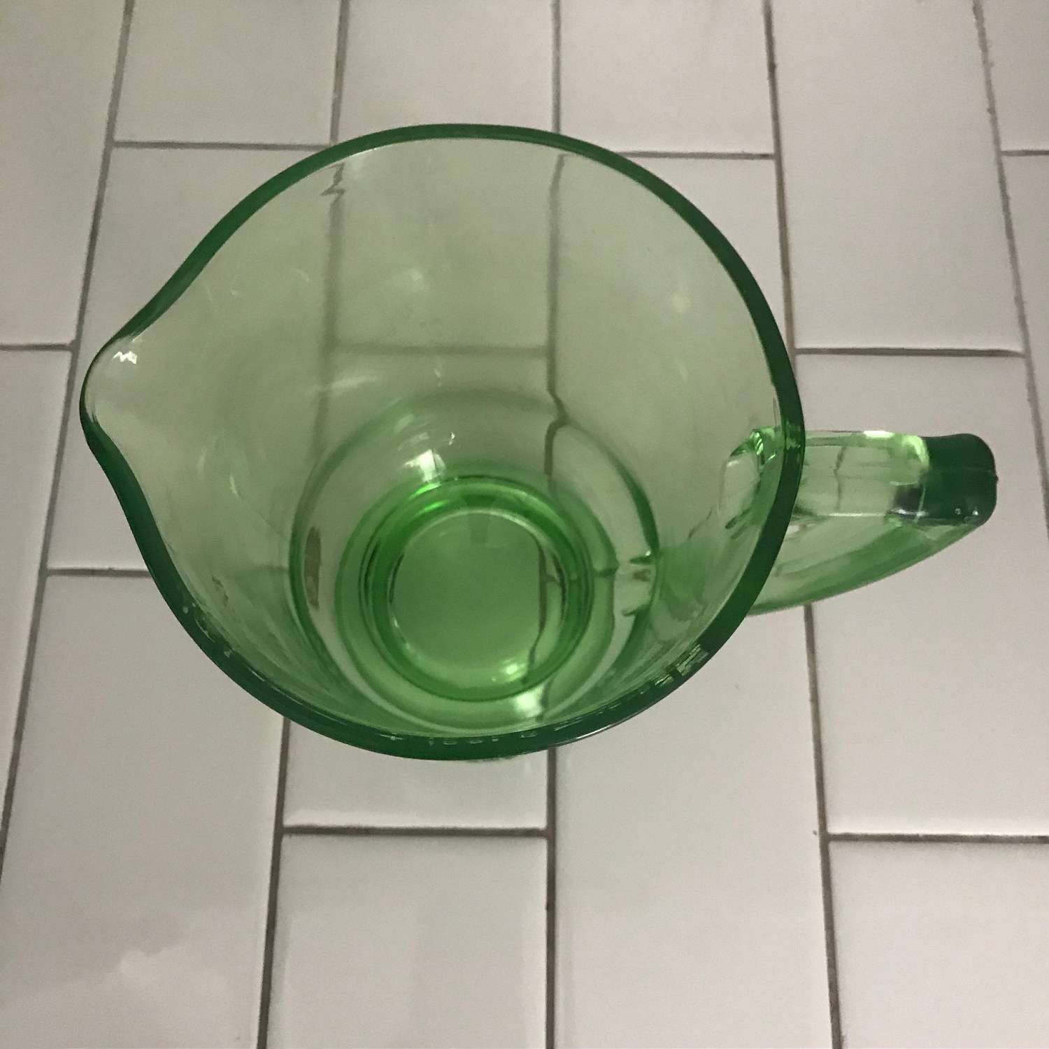 https://www.truevintageantiques.com/wp-content/uploads/2019/12/antique-uranium-glass-measuring-cup-4-cups-green-kitchen-collectible-display-farmhouse-glows-green-5df179508-scaled.jpg