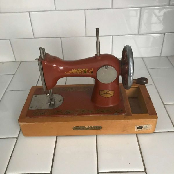Child size USSR sewing machine Dark Orange Lots of Gold scroll work All metal original 1930's hand crank