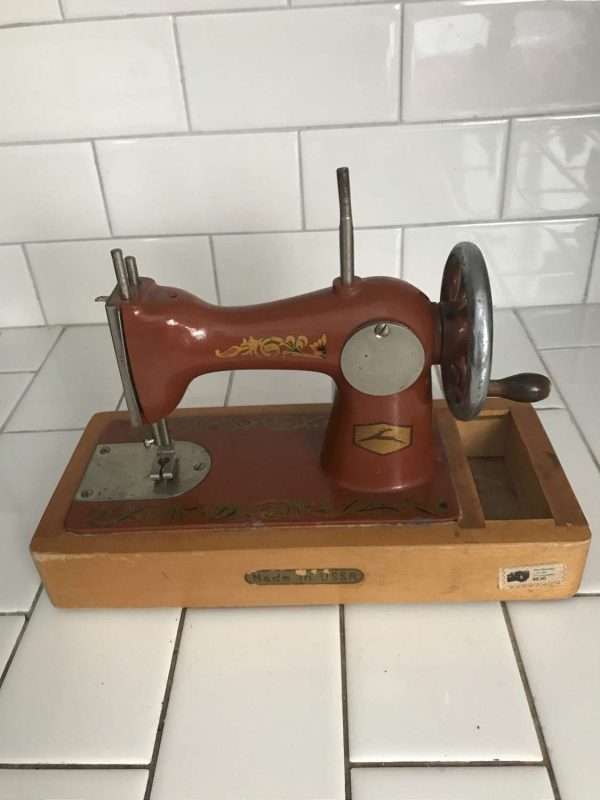 Child size USSR sewing machine Dark Orange Lots of Gold scroll work All metal original 1930's hand crank