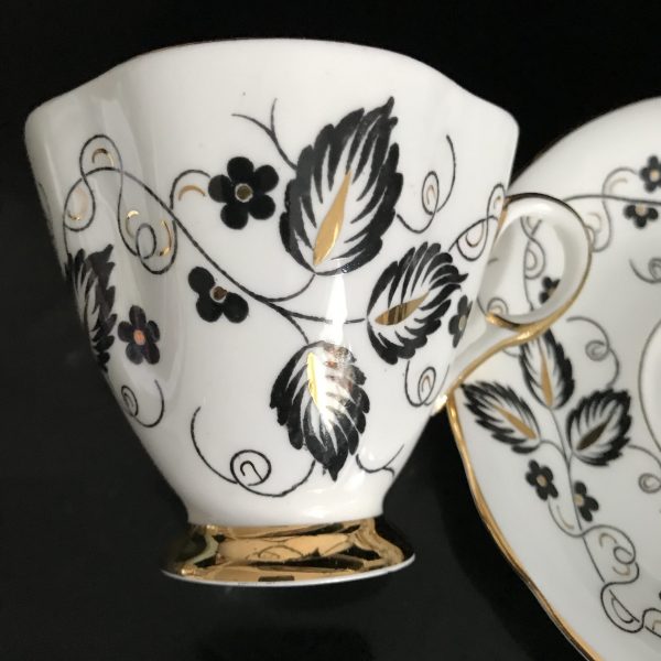 Clarence tea cup and saucer England Fine bone china Art Deco Black & Gold Leaves heavy gold trim farmhouse collectible display coffee