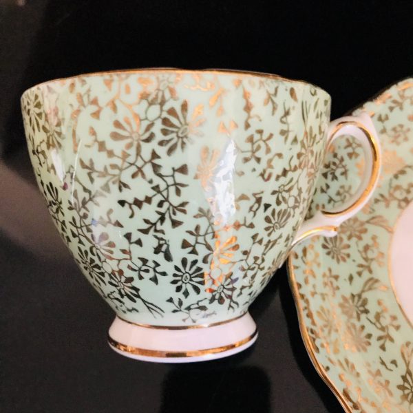 Colclough tea cup and saucer England Fine bone china light green chintz heavy gold trim farmhouse collectible display