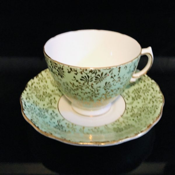 Colclough tea cup and saucer England Fine bone china light green chintz heavy gold trim farmhouse collectible display