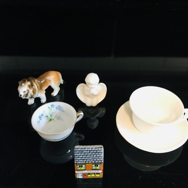 Collectible lot of miniatures curio tea cup and saucer tea cup occupied Japan Lion figurine cherub post office Great Britain trinkets
