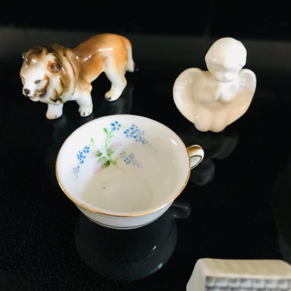 Collectible lot of miniatures curio tea cup and saucer tea cup occupied Japan Lion figurine cherub post office Great Britain trinkets