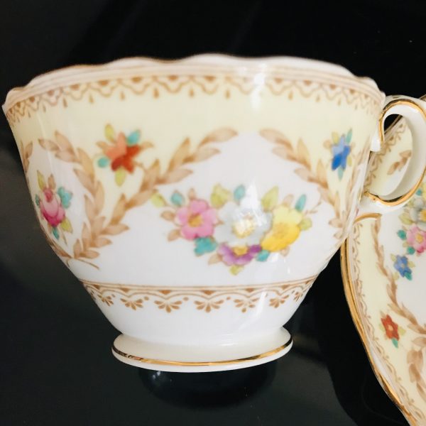 Crown Staffordshire tea cup and saucer England Fine bone china Light Yellow pink yellow blue flowers gold trim farmhouse collectible display
