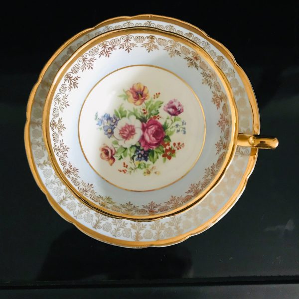 Early Regency Tea cup and saucer England Fine bone china Gorgeous light blue trim with heavy gold floral center  collectible display bridal