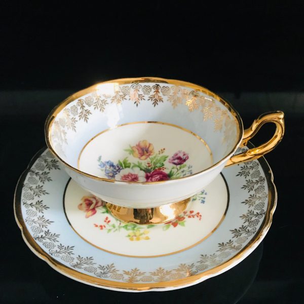 Early Regency Tea cup and saucer England Fine bone china Gorgeous light blue trim with heavy gold floral center  collectible display bridal