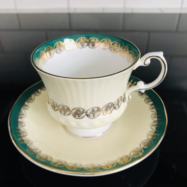 Elizabethan Tea cup and saucer Fine bone china England gold and green on ivory Ribbed china gold trim farmhouse collectible display
