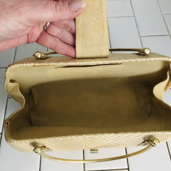 Exceptional hard side mid century purse top metal trim and top handles barrel clasp front brass button bottom collectible display tv movie