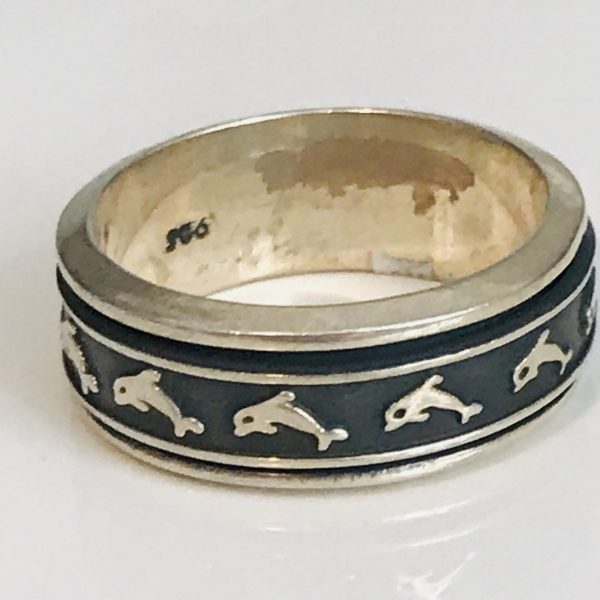 Men's Sterling silver vintage ring dolphin pattern  marked .925 size 12 dolphin band spins withing the band 12 grams
