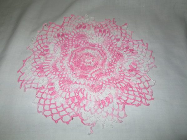 Pretty pink variegated hand made doily round 8 1/4" across