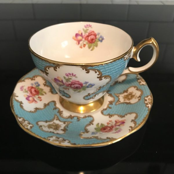 Queen Anne tea cup and saucer England Fine bone china Pink Yellow Blue bouquet Aqua background farmhouse collectible display coffee