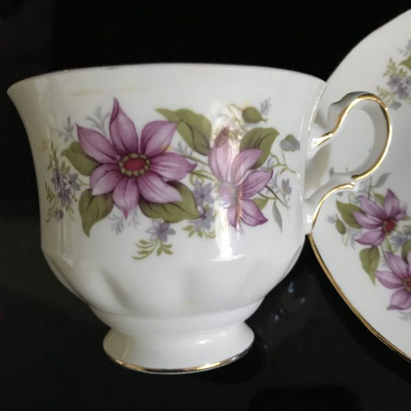 Queen Anne tea cup and saucer England Fine bone china Purple flowers with red centers gold trim farmhouse collectible display dining coffee
