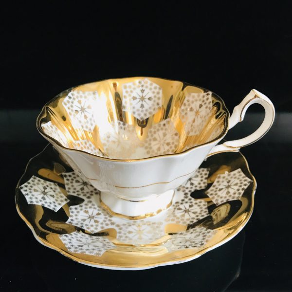 Queen Anne tea cup and saucer England Fine bone Gold with White and gold geometric design fine detail stunning heavy gold display bridal