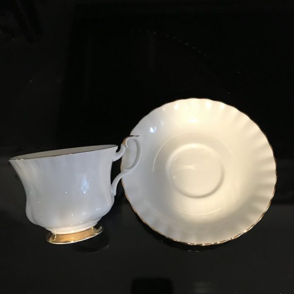 Royal Albert tea cup and saucer England Fine bone china White with gold trim farmhouse collectible display coffee serving sleek