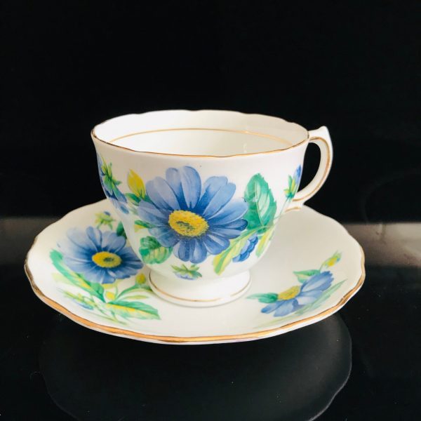 Royal Vale Tea cup and saucer England Fine bone china Blue Daisies with yellow centers farmhouse collectible display bridal