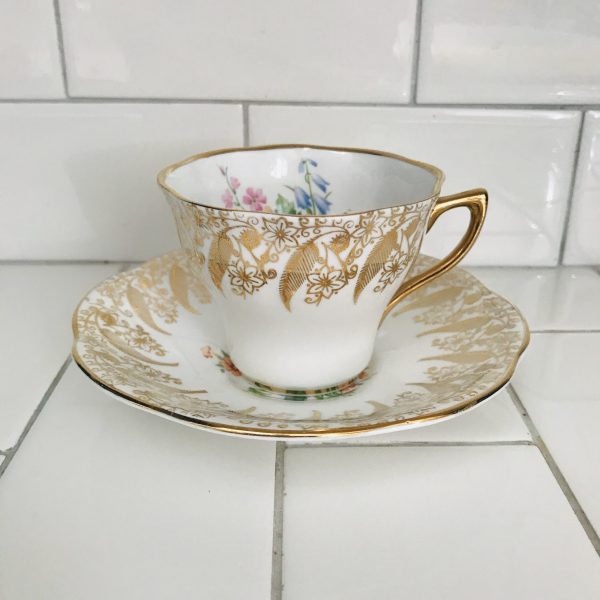 Sandringham Tea Cup and Saucer Fine bone china England heavy gold floral outside bouquet inside pink blue orange yellow purple Display