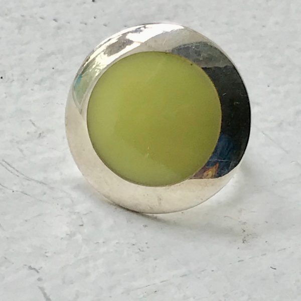 Sterling silver vintage ring greenish yellow stone incased in sterling size 6 3/4 marked .925 weighs 8 grams