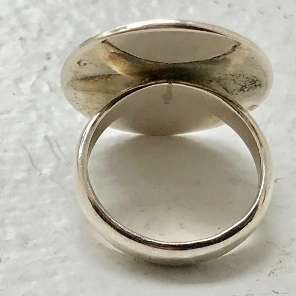 Sterling silver vintage ring greenish yellow stone incased in sterling size 6 3/4 marked .925 weighs 8 grams