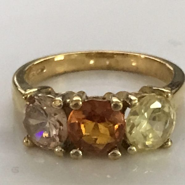 Sterling silver vintage ring with gold wash topaz periodot and pink Tourmaline size 7 weighs 4.2 grams