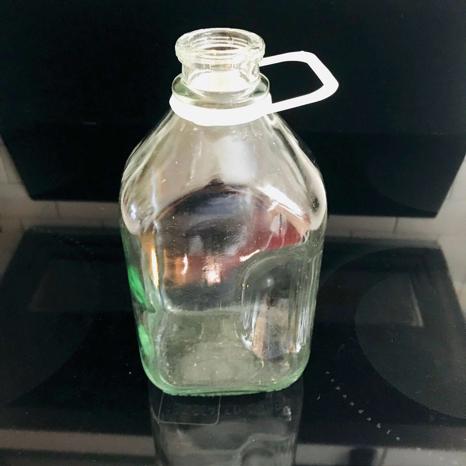 https://www.truevintageantiques.com/wp-content/uploads/2019/12/vintage-1-2-gallon-glass-milk-jug-delivery-bottle-with-handle-collectible-farmhouse-display-cabin-cottage-lodge-cold-milk-refrigerator-jar-5df1abe61-scaled.jpg