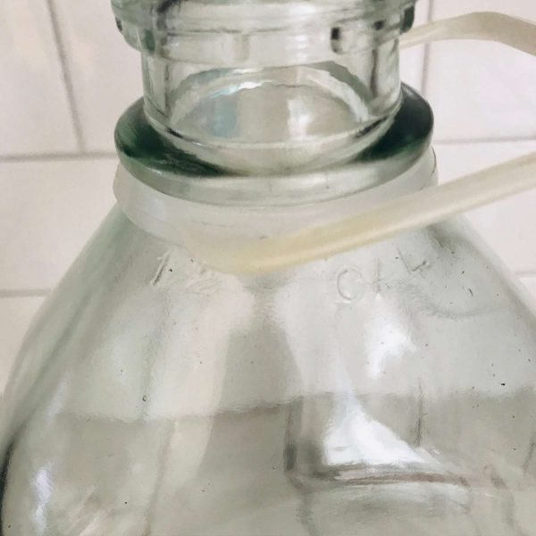 Vintage 1/2 gallon glass milk jug delivery bottle with handle collectible farmhouse display cabin cottage lodge cold milk refrigerator jar