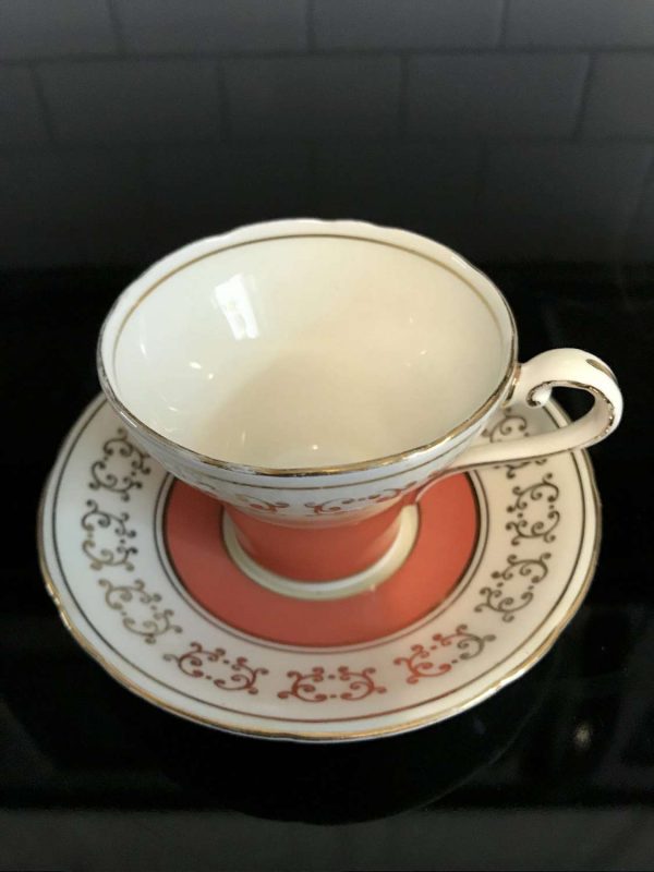 Vintage Aynsley Demitasse Corset Shape Tea cup and saucer Dark Peach with gold trim ivory background collectible display