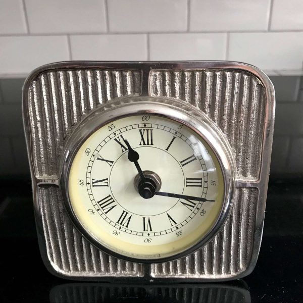 Vintage chrome clock designed to look like vintage auto gauge quartz working clock