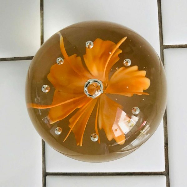 Vintage glass paperweight bright orange feather like flower with controlled bubble center collectible display home decor