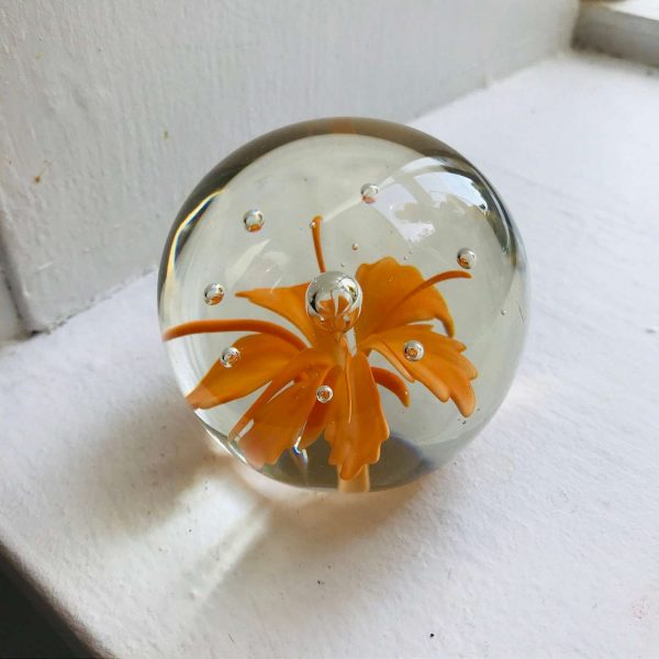 Vintage glass paperweight bright orange feather like flower with controlled bubble center collectible display home decor