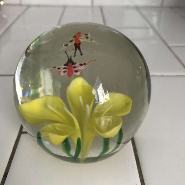 Vintage glass paperweight Yellow flower green leaves and 2 butterflies in the top over the flower collectible display home decor
