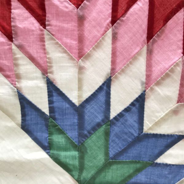 Vintage hand made quilt topper lined but not filled light weight Texas Star or Sunflower Blue trim Red pink blue peach green body