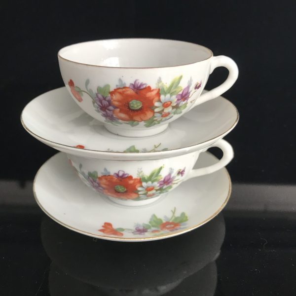 Vintage pair of Japanese Demitasse tea cups and saucers bright orange flowers purple violas dainty fine bone china collectible display