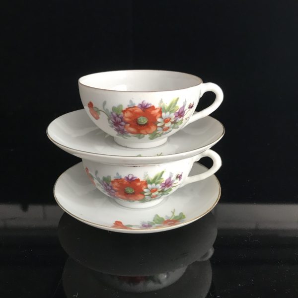 Vintage pair of Japanese Demitasse tea cups and saucers bright orange flowers purple violas dainty fine bone china collectible display