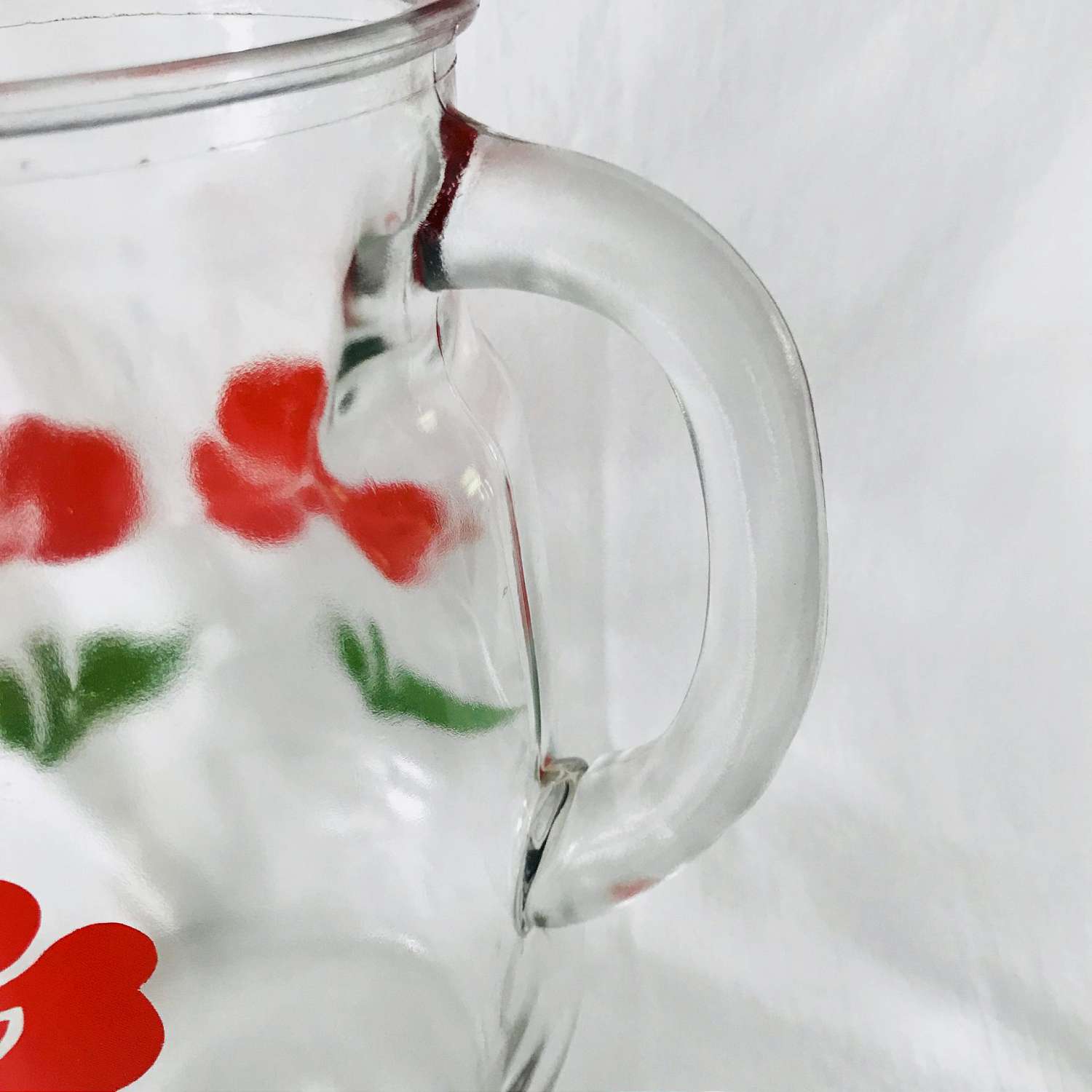 https://www.truevintageantiques.com/wp-content/uploads/2019/12/vintage-pitcher-glass-fired-on-paint-red-flowers-iced-tea-koolaid-collectible-retro-kitchen-display-farmhouse-summer-picnic-patio-water-5df9536f2-scaled.jpg