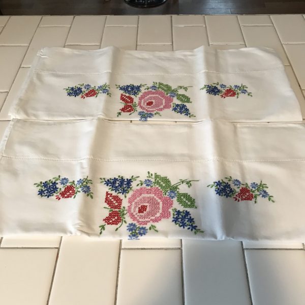 Beautiful Embroidered Pillowcase pair Cotton with Hemstitch Pink Roses blue flowers red & green trim collectible farmhouse bed and breakfast