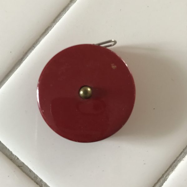 Vintage Sewing Notions 1950's Red Metal with push button closure  collectible display metal with yellow cloth measurer MINT condition round