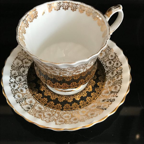 Queen Anne tea cup and saucer England Fine bone china Black with heavy gold trim farmhouse collectible display