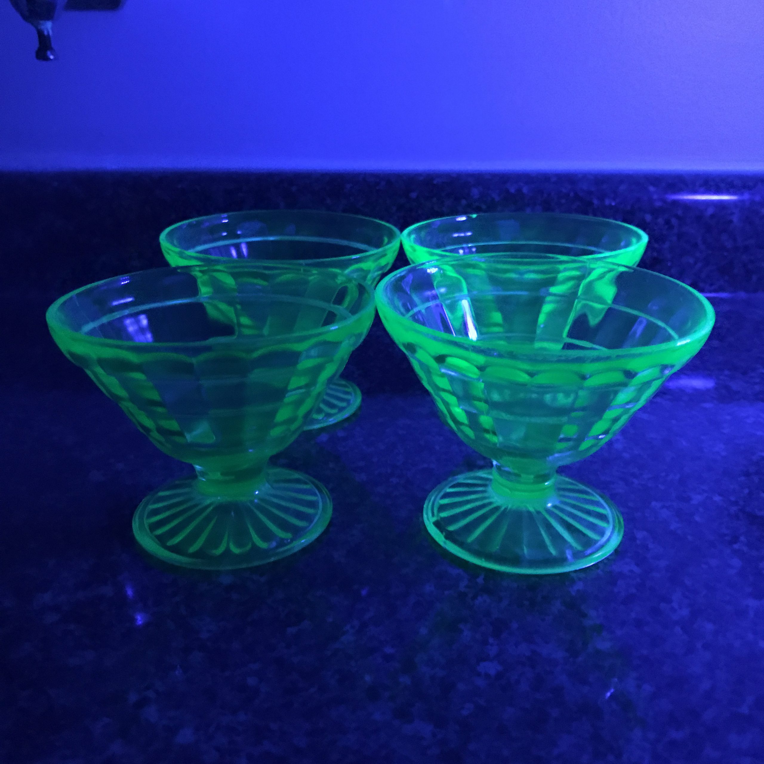 https://www.truevintageantiques.com/wp-content/uploads/2020/03/set-of-4-uranium-glass-sherbet-cups-block-optic-dessert-bowls-fruit-cups-green-glass-farmhouse-collectible-display-kitchen-dining-5e5c4b783-scaled.jpg